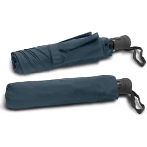 A tri-fold umbrella in a dark blue colour, featuring a handle and a strap for easy carrying.