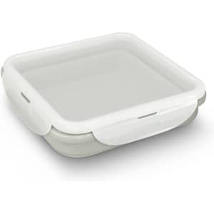 A collapsible lunch box in light grey with a white lid, featuring a simple design and a logo on the side.