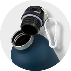 A drink bottle in deep blue with a black screw-on lid and a metal carabiner attached. Features a logo.