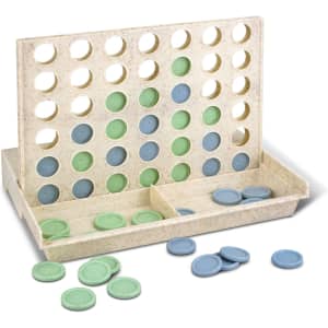 A Four in a Row game with a light-coloured board and blue and green game discs scattered around.