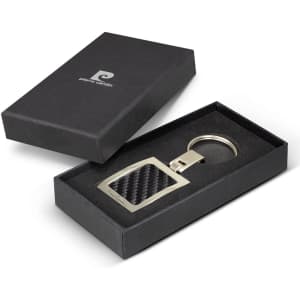 A key ring with a silver metal frame and a carbon fibre design, presented in a black box.