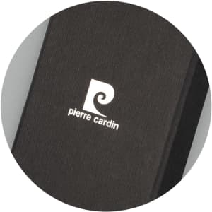 A black key ring featuring a sleek design and a logo. The surface has a textured finish.