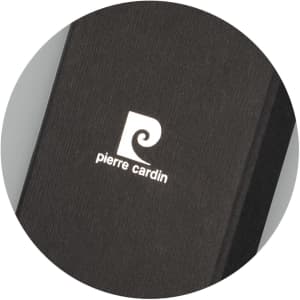 A black key ring with a textured finish and a white logo on its surface.