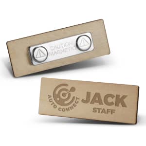 A wooden badge in light brown with a magnetic backing. Features a logo on one side and a caution symbol on the other.
