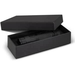 A black torch presented in an open black box, featuring a sleek design and a clip for attachment.