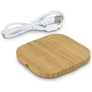A square bamboo wireless charger in natural wood colour, accompanied by a white USB charging cable.