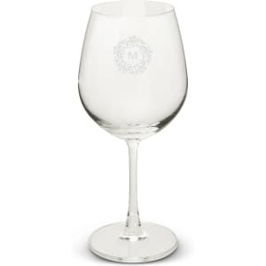 A clear wine glass with a large bowl and a slender stem, featuring a decorative logo design.