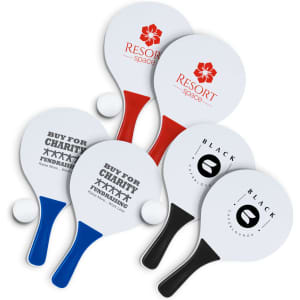 A set of paddle ball game paddles in red, blue, black, and white, featuring various logos. Two balls included.