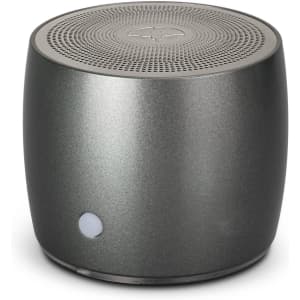 A sleek grey Swiss Peak Bass Speaker with a rounded design and perforated top for sound. Features a logo on the side.