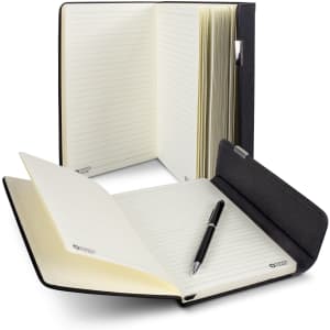 A Swiss Peak A5 notebook in black with lined pages, accompanied by a matching pen, displayed open and closed.