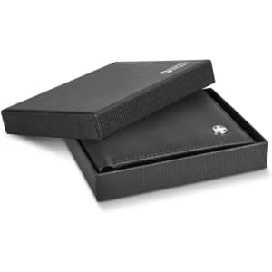 A black wallet in an open box with a logo, featuring a sleek design and textured exterior.