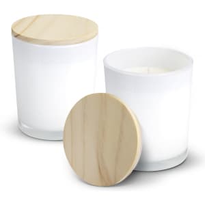 A pair of white scented candles with wooden lids, displayed in clear glass containers.