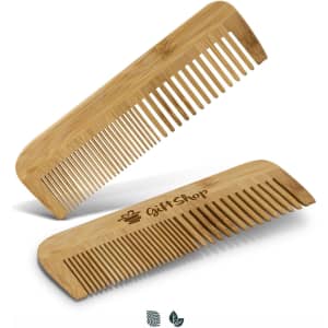 A bamboo hair comb in a light brown shade, featuring a logo on one side. Two combs are displayed, one angled over the other.