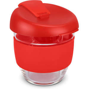 A drink bottle in red, featuring a silicone band and a lid, made of borosilicate glass.