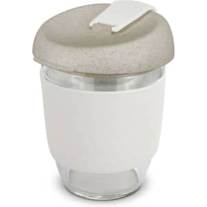 A drink bottle featuring a clear body with a beige, textured lid and a white silicone sleeve.
