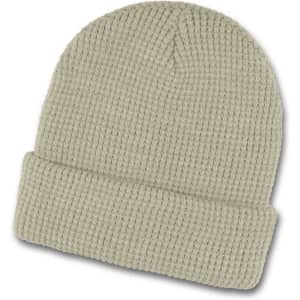 A Galway Waffle Beanie in a soft, light green colour with a textured knit pattern and a folded brim.