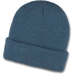 A blue waffle beanie featuring a ribbed texture and a folded cuff, with a logo on the side.