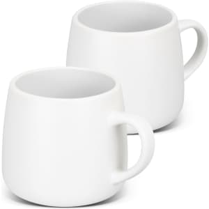 A drinkware set of two white ceramic coffee mugs with rounded shapes and handles, featuring a smooth finish.