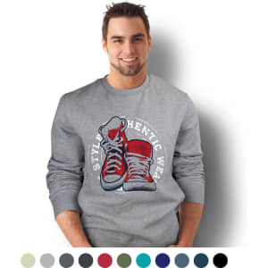 A grey unisex sweatshirt featuring a graphic of red sneakers and a logo, modelled by a smiling male.