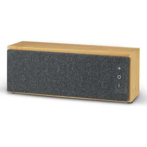 A rectangular Bluetooth speaker with a wooden base and a grey fabric front, featuring a logo and volume controls.