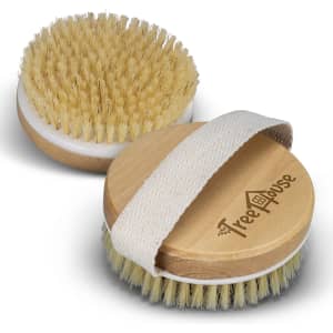 A wooden body brush with a light-coloured handle and bristles, featuring a strap and logo on the side.