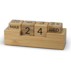 A bamboo desk calendar featuring wooden blocks for day, date, and month. The blocks are arranged on a rectangular base.