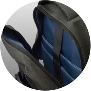 A grey backpack with blue interior compartments and padded sections. It features a logo.
