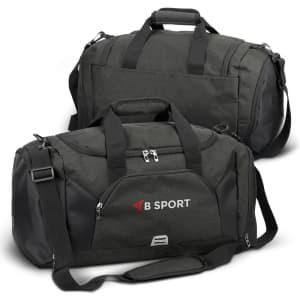 A green duffle bag features black accents and has a logo. It includes handles and a detachable shoulder strap.