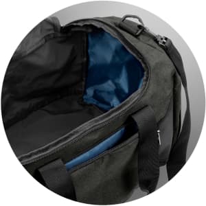 A dark green duffle bag with a blue interior and multiple compartments. It has a logo and sturdy handles.