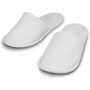 White waffle slippers with a textured surface and soft interior, featuring a simple design without visible branding.