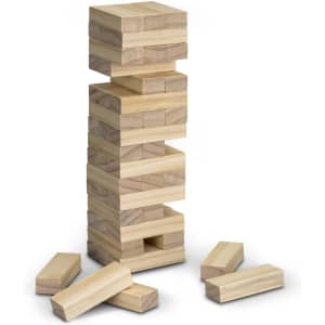 A wooden Mini Tumbling Tower game featuring stacked blocks in light brown, with extra blocks laid around it.