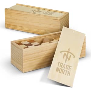 A wooden brain teaser set in a light-coloured box, featuring various wooden puzzle pieces inside. The box has a logo.