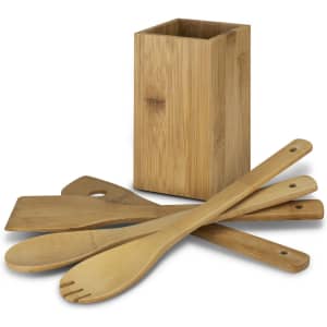 Bamboo kitchen utensils, including spoons and a spatula, arranged with a rectangular holder in a natural finish.