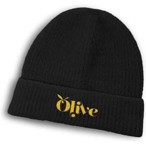 A black beanie featuring a logo in gold. The beanie has a ribbed texture and a folded cuff.
