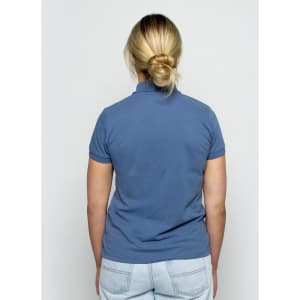 A back view of a women's polo shirt in a soft blue colour, featuring a fitted design and short sleeves.