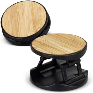 A bamboo phone holder featuring a circular bamboo top and a black base, positioned in two angles.