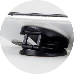 A black phone holder with a sturdy base, designed to support a smartphone.