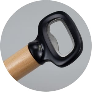 A drink bottle opener featuring a wooden handle and a black plastic grip, with a metal opening mechanism.