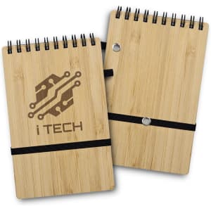 A bamboo notepad with a spiral binding and an elastic band, featuring a logo on the cover.