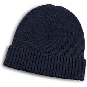 A navy blue merino wool beanie with a ribbed design and a folded cuff. It features a small logo.