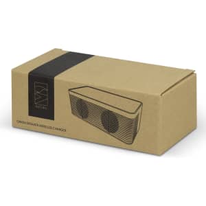 A brown cardboard box containing the NATURA Oaken Speaker Wireless Charger, featuring a simple design and logo.