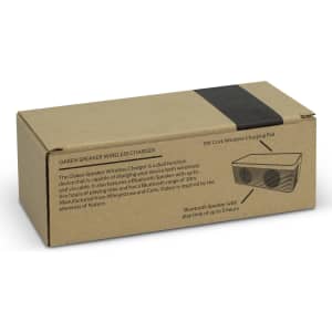 A rectangular box for the NATURA Oaken Speaker Wireless Charger, featuring a cork design and a logo.