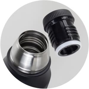 A drink bottle in matte black with a stainless steel top and a removable black cap. It has a logo on the body.