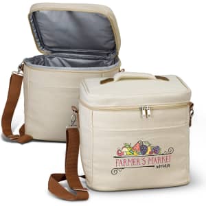A cream-coloured cooler bag with a zippered top and a brown shoulder strap, featuring a logo.