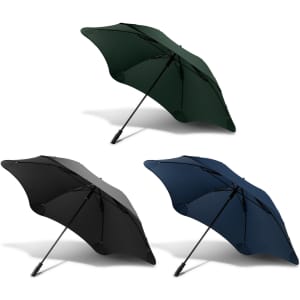 A set of three BLUNT Sport Umbrellas in dark green, black, and navy blue, featuring a logo on each.
