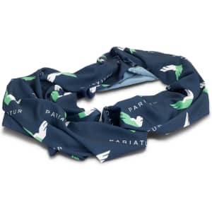 A blue infinity scarf featuring a green and white abstract design, with a logo present on the fabric.