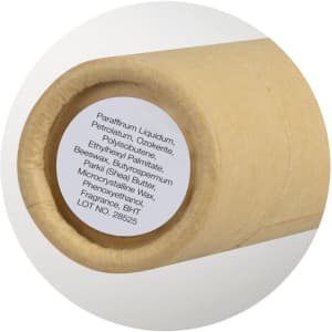 A Kraft Lip Balm tube in a natural brown paper packaging, featuring a circular label with ingredients.
