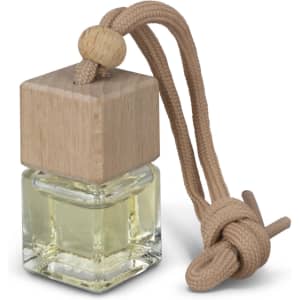 A glass bottle with a wooden top and a beige hanging cord, containing a clear liquid for a car air freshener.