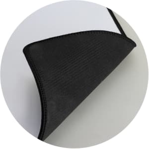 A black gaming mat with a textured surface and stitched edges, featuring a smooth underside.