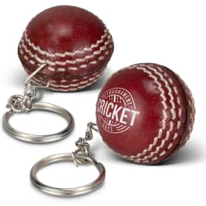 A cricket ball key ring in a rich red colour with white stitching and a metal keyring attachment.